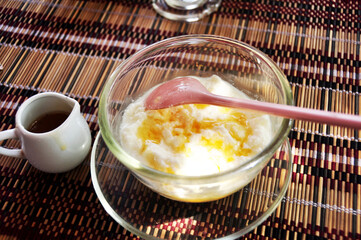 Yogurt topping honey burma style serve on glass bowl for sale burmese people and foreign travelers in Bagan or Bagan ancient city in Mandalay Region of Myanmar