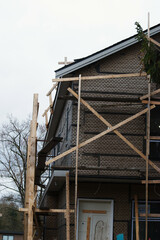 Fototapeta premium scaffolding on house under construction