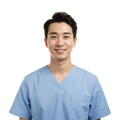 Smiling young Asian healthcare professional in blue scrubs looking friendly and approachable on black.