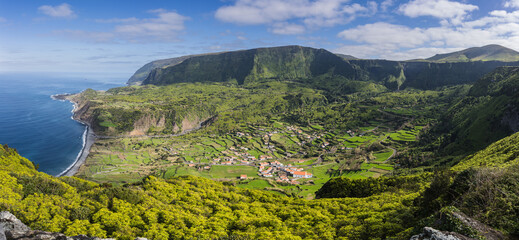 Aerial view over landscape with mountains and the small village of Fajazinha, isle of Flores Azores Portugal