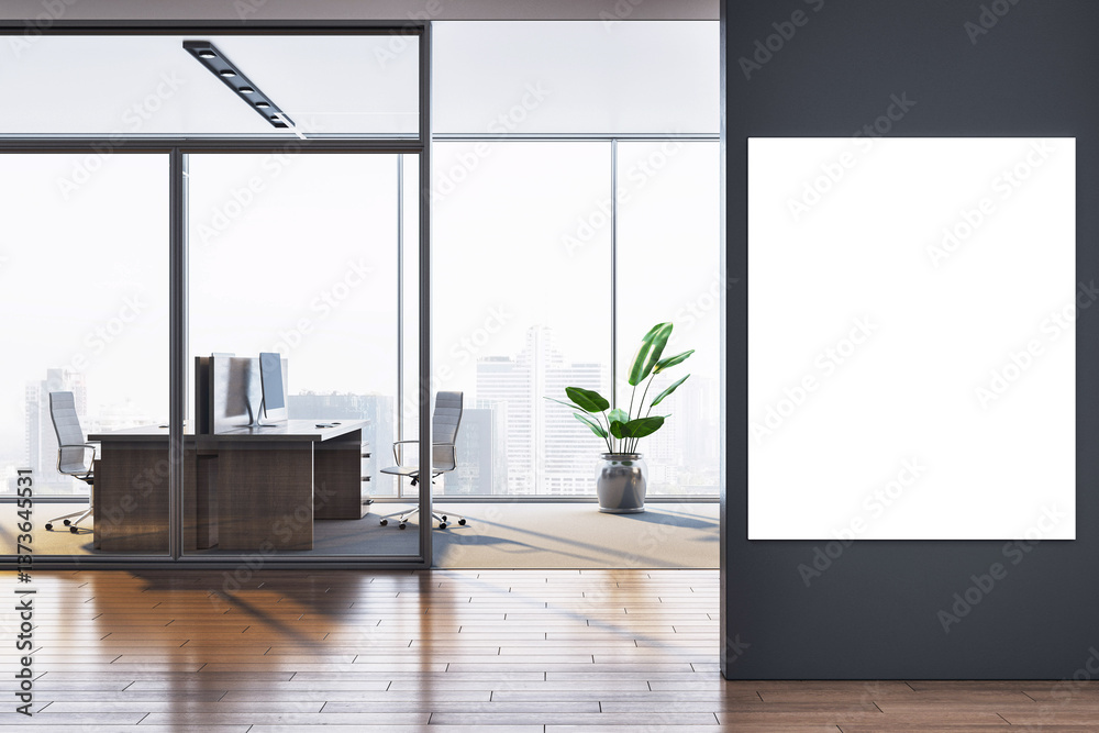 Poster modern office interior with glass walls and wooden floor featuring a blank vertical poster frame on 