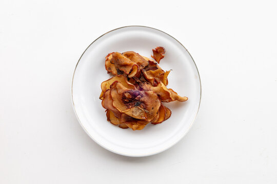 Dried Garcinia Atroviridis Slices Known as Asam Gelugur for Culinary and Herbal Medicine Concept