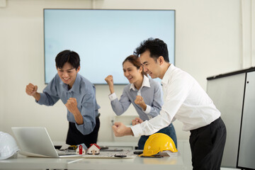 Excitement and Future Planning. Architects and engineers eagerly discussing next project steps.