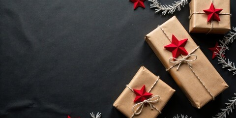 Fototapeta premium A Festive Arrangement of Wrapped Gifts with Red Stars and Winter Branches on a Dark Background