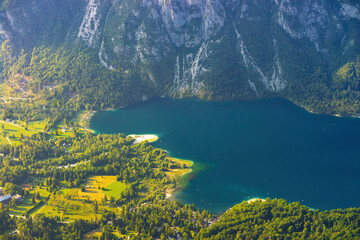 Breathtaking aerial view of Lake Bohinj in Slovenia's Julian Alps, revealing serene turquoise...