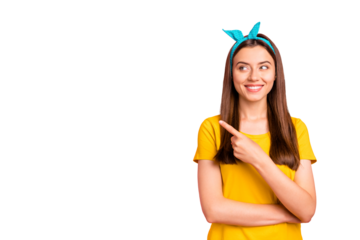 Portrait of charming promoter pointing at copy space looking wearing yellow t-shirt isolated over pink background