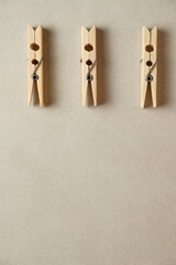 Elegant wooden clothespins arranged neatly on a soft-toned background