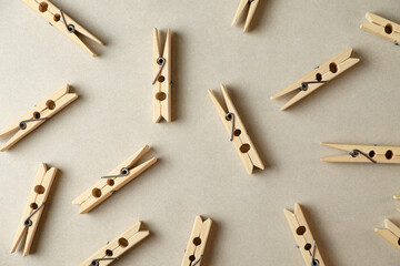 Creative arrangement of wooden clothespins scattered on a neutral backdrop