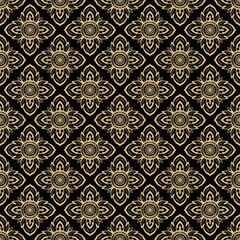 Intricate floral pattern featuring gold outlines on a black background.