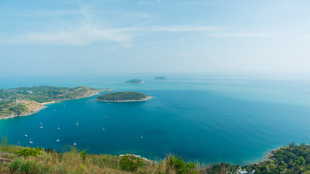 Top view of tropical island in the blue ocean sea, in phuket - Powered by Adobe
