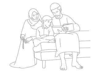 young muslim family reading quran during ramadan