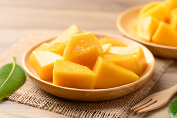 Cube mango on wooden plate ready to eating, Tropical fruit in summer season