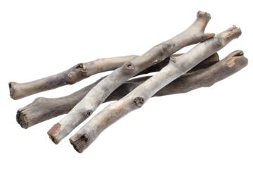several weathered wooden sticks lying casually together isolated on transparent white background