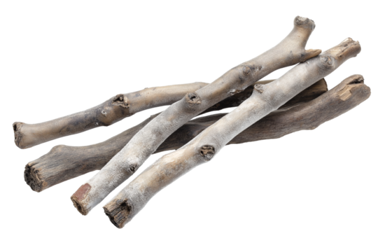 several weathered wooden sticks lying casually together isolated on transparent white background