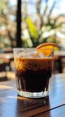 A minimalist high-end product photography shot of a ice bumble coffee (Bumblebee coffee). Orange coffee, tonic, coffee lemonade	