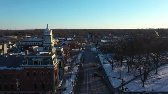 4K drone footage of Medina Square, Ohio reveals the Medina Courthouse clock tower at sunset