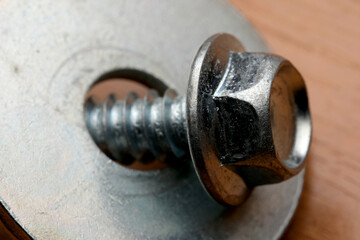 Close-up view of a shiny metal bolt and washer