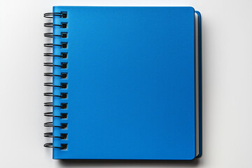 Close-Up of a Blue Spiral Notebook on White Background.  School items — universal educational or celebratory design base.