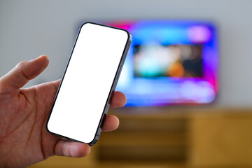 Smartphone mockup screen, man holding mobile phone in front of television set, tv remote app and tv...