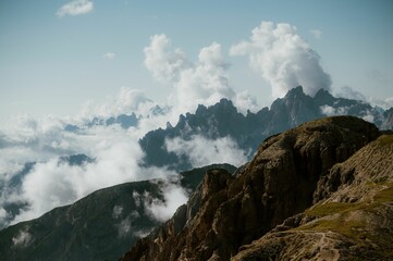 Dolomite mountains with dramatic clouds and rugged peaks.