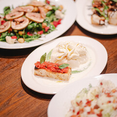 Charming and cozy interior of an Italian restaurant, featuring rustic decor and a warm, inviting atmosphere.