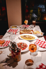 Charming and cozy interior of an Italian restaurant, featuring rustic decor and a warm, inviting atmosphere.