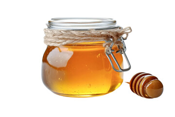 honey jar with dipper - golden honey in glass jar