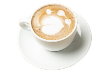 Steaming cappuccino decorated with latte art sits in a white cup and saucer, ready to be enjoyed