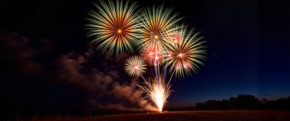 Dazzling fireworks illuminating night sky in rural setting, celebration