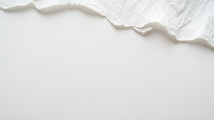 A close-up view of crumpled white paper with textured edges. creating a soft. artistic background ideal for minimalistic design projects or creative presentations