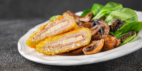 Cordon Bleu Cutlet meat chicken, ham, cheese appetizer dish fresh delicious gourmet food background on the table rustic food top view copy space