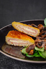 Cordon Bleu Cutlet meat chicken, ham, cheese appetizer dish fresh delicious gourmet food background on the table rustic food top view copy space