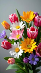 Obraz premium Colorful spring flowers in a vibrant bouquet with a mix of tulips, daisies, lilies, and roses, colorful, spring