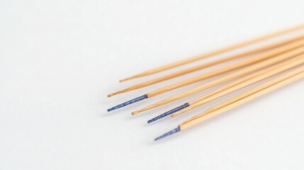 Wooden knitting needles with blue tips, Close up of wooden knitting needles