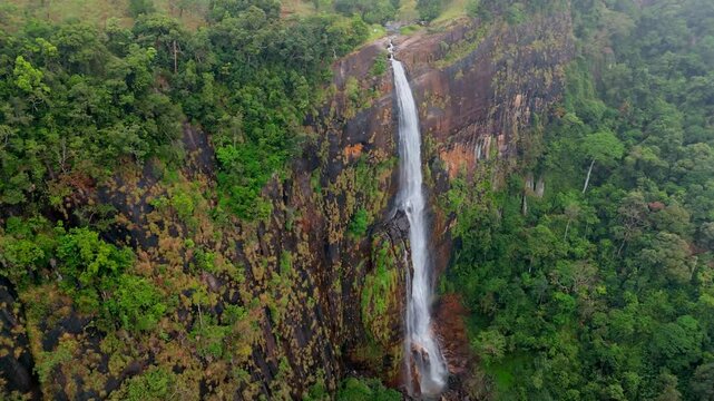 Experience the surreal ambiance of Ella, Sri Lanka, with this breathtaking aerial drone footage of Diyaluma Falls.