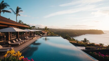 Fototapeta premium Sleek pool at a tropical resort offers stunning ocean views, surrounded by palm trees and colorful flowers, all under a bright sunny sky in a tranquil setting