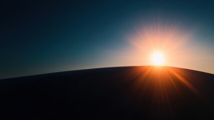 A stunning horizon with the sun setting, casting a warm glow and radiant lens flare against a darkening sky, evoking a sense of calm and wonder.