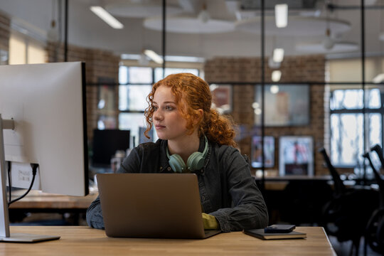 New employee working late on a computer in an office