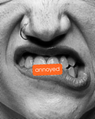 Annoyed. Contemporary art collage. Gritted teeth and tense facial muscles with orange tag, showing...