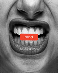 Mad. Composite image. Clenched teeth with red label overlaid, symbolizing anger. Comic-style...