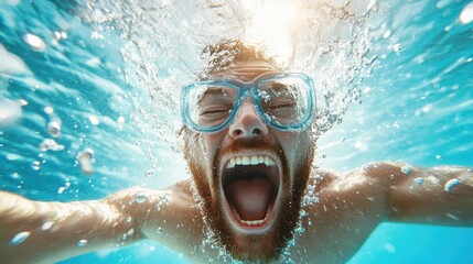Fototapeta premium A dynamic underwater shot captures a man swimming joyfully, with splashes and bubbles emphasizing a sense of freedom and exhilaration in the aquatic scene.