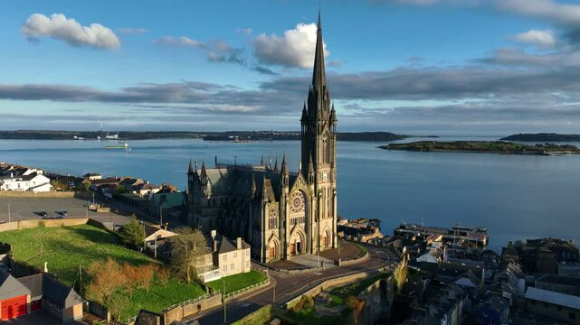 flying around the St Colmas cathedral in Irish town of Cobh, Cork county, Ireland, travel and tourism in Ireland, gothic cathedral in Ireland 