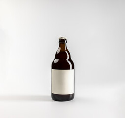 Mockup of 500ml beer bottle, on white background with copyspace, real photo