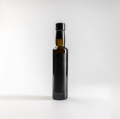 Mockup of premium extra virgin olive oil bottle, on white background with copyspace, 750 ml, real photo