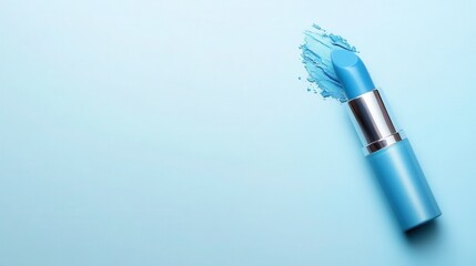 A bright blue lipstick lying against a soft backdrop, complemented by a vivid smudge of color, emphasizing a playful and artistic approach to contemporary beauty.