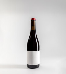 Mockup of classic bottle of red wine garnacha, on white background with copyspace, 750 ml, real photo