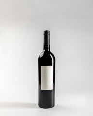 Mockup of classic bottle of red wine garnacha, on white background with copyspace, 750 ml, real photo