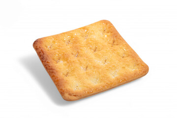 Single golden-brown sugar cracker, square-shaped, casting a soft shadow on a white background.