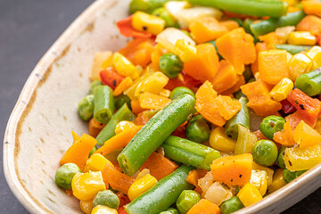 Mexican Mix of Vegetables. Tomatoes, Green Beans, Peas, Corn. Dietary Food.Bright vegetable mix .Vegetarian food.Assorted.