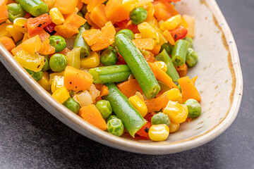 Mexican Mix of Vegetables. Tomatoes, Green Beans, Peas, Corn. Dietary Food.Bright vegetable mix .Vegetarian food.Assorted.